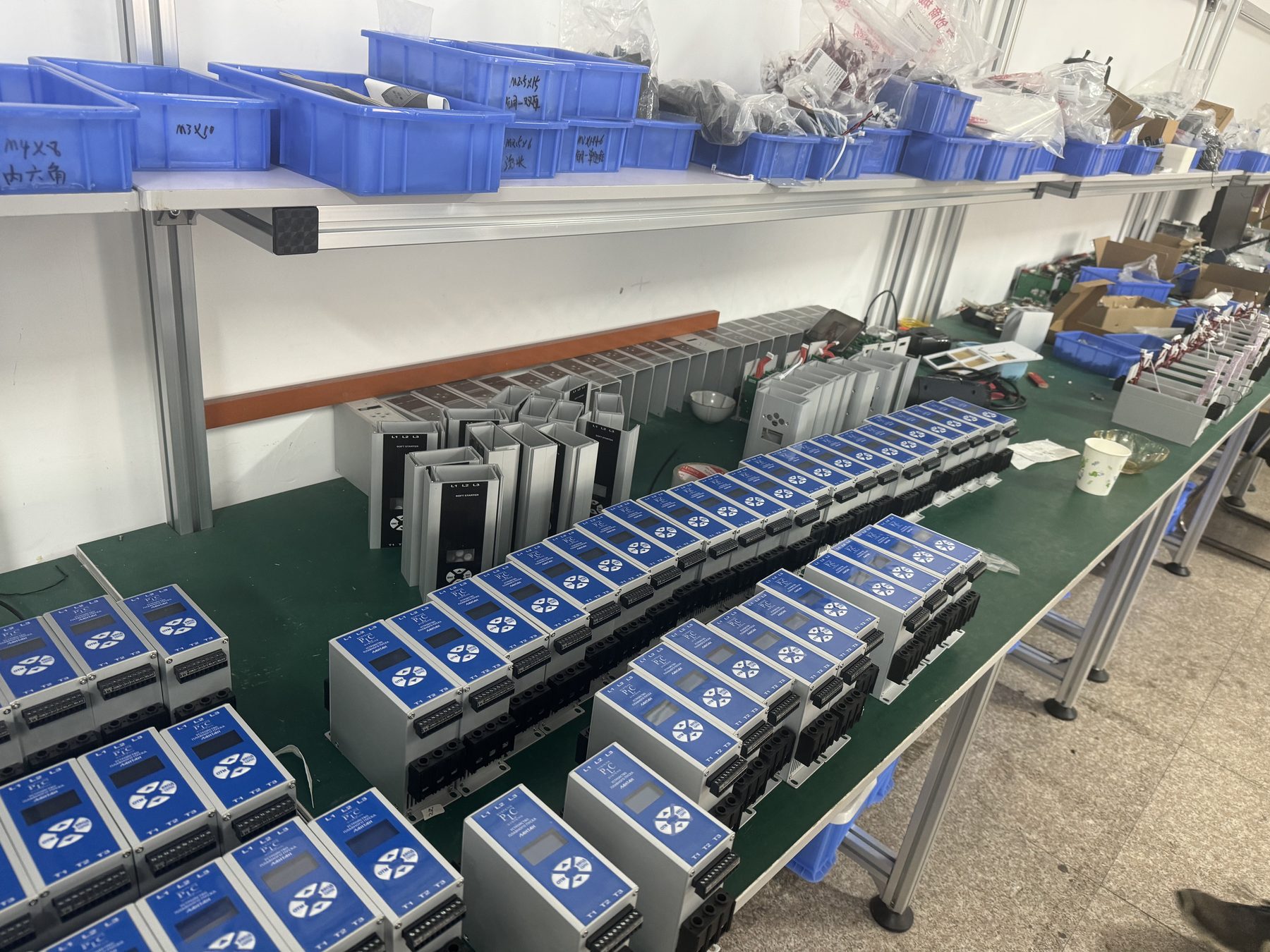 Rows of finished soft starters on assembly line at ShunCtrl factory