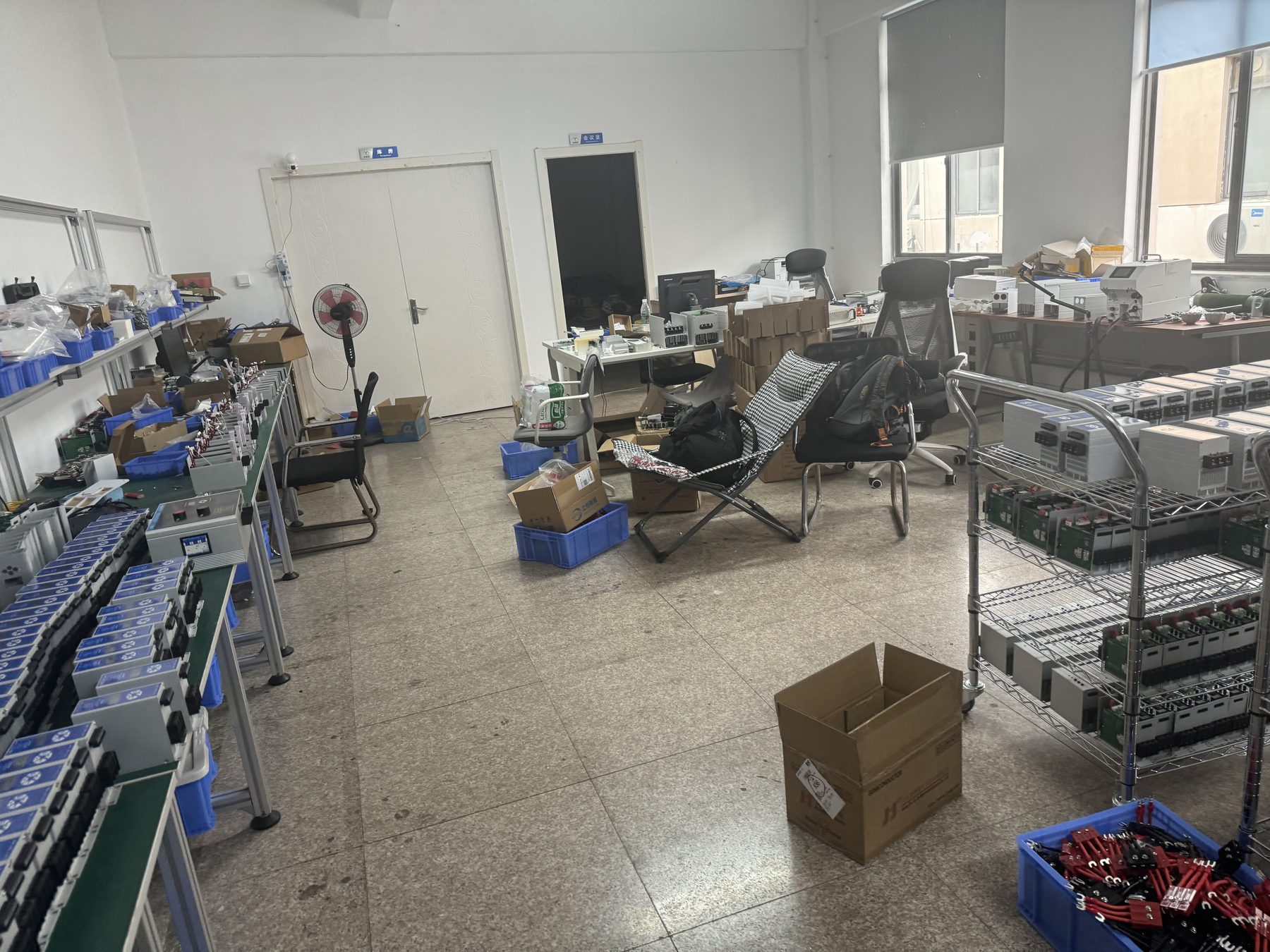 ShunCtrl workshop floor with finished units staged for dispatch